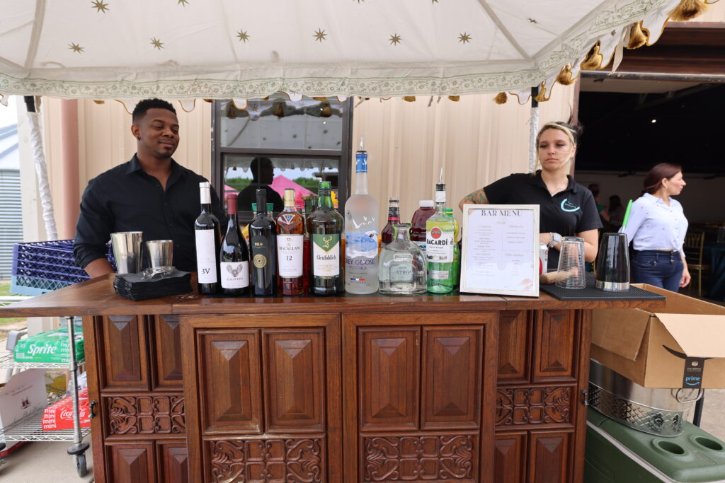 Antique bar cabinet setup for weddings and events at Castle Waterford in Royse City, Texas