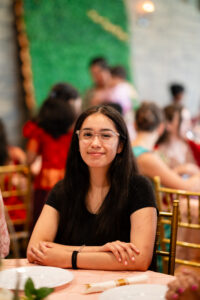 Young woman smiling at Castle Waterford wedding reception