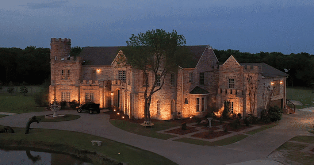 Castle Waterford illuminated at dusk with warm lighting and scenic surroundings
