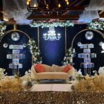 Luxury wedding stage setup with floral décor, sofa seating, and elegant backdrop at Castle Waterford