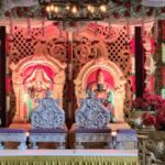 Traditional wedding stage setup with ornate chairs and vibrant décor at Castle Waterford