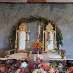 Luxury wedding stage with royal chairs, floral décor, and candle setup at Castle Waterford