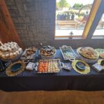 Wedding food display table with desserts, snacks, and elegant presentation at Castle Waterford