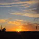 Beautiful sunset view near Castle Waterford with golden sky and horizon landscape