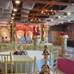Traditional wedding mandap setup with seating and decorative pillars at Castle Waterford indoor venue