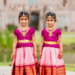 Twin girls in traditional Indian attire posing together at Castle Waterford wedding celebration