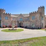 Castle Waterford front courtyard with fountain and grand entrance during daytime