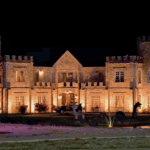 Castle Waterford illuminated at night showcasing grand architecture and event lighting