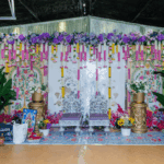 Haldi ceremony décor with hanging floral decorations and traditional setup at Castle Waterford