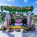 Traditional haldi ceremony setup with floral canopy, seating, and ritual items at Castle Waterford