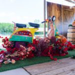 Colorful wedding décor with scooter prop and floral arrangement at Castle Waterford pre-wedding setup