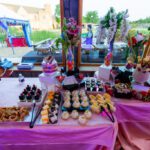 Wedding dessert and sweets display table with cupcakes, pastries, and décor at Castle Waterford