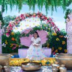 Haldi ceremony setup with floral arch, seating, and traditional ritual items at Castle Waterford