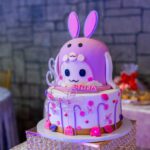 Cute bunny themed cake with pink design for birthday celebration at Castle Waterford