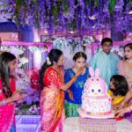 Family celebrating birthday with bunny themed cake at Castle Waterford event setup