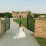 Castle Waterford entrance gate during sunset with colorful sky and open landscape
