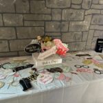 Wedding props table with fun signs and accessories for photo booth at Castle Waterford