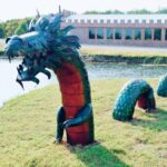 Dragon sculpture near lake at Castle Waterford with unique outdoor décor