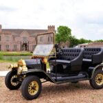 Vintage car parked at Castle Waterford with historic castle backdrop and outdoor setting
