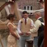 Bride and groom exchanging vows during intimate outdoor wedding ceremony at Castle Waterford