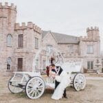 Bride and groom posing with vintage carriage in front of Castle Waterford wedding venue