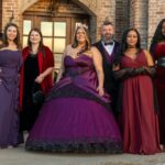 Group of elegantly dressed guests posing at Castle Waterford event in formal evening attire