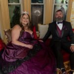 Couple seated in formal evening attire during wedding celebration at Castle Waterford indoor setting