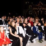 Guests seated and enjoying wedding ceremony at night at Castle Waterford outdoor setup