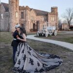 Couple embracing in elegant wedding attire with dramatic gown at Castle Waterford outdoor setting