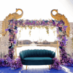 Luxury floral wedding backdrop with velvet sofa and decorative frame at Castle Waterford